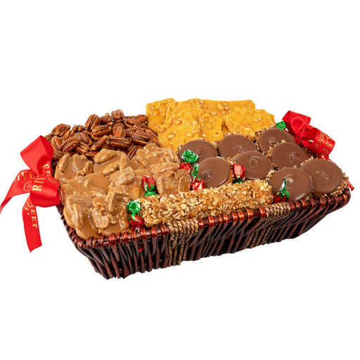 Assorted candy basket with a variety of treats including toffee, nuts, and chocolate on a white background.