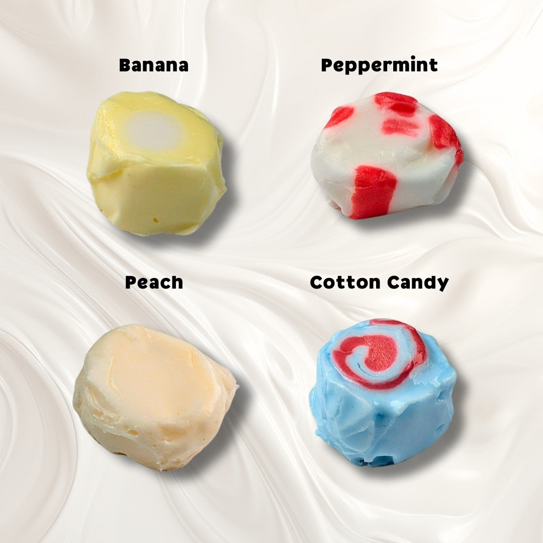 A white background with four pieces of taffy