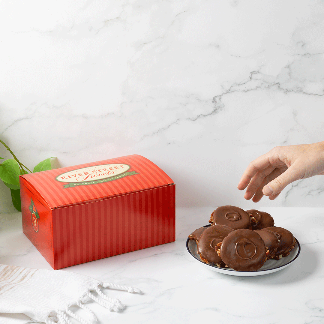 Hand grabbing bear claw with a red box in the background
