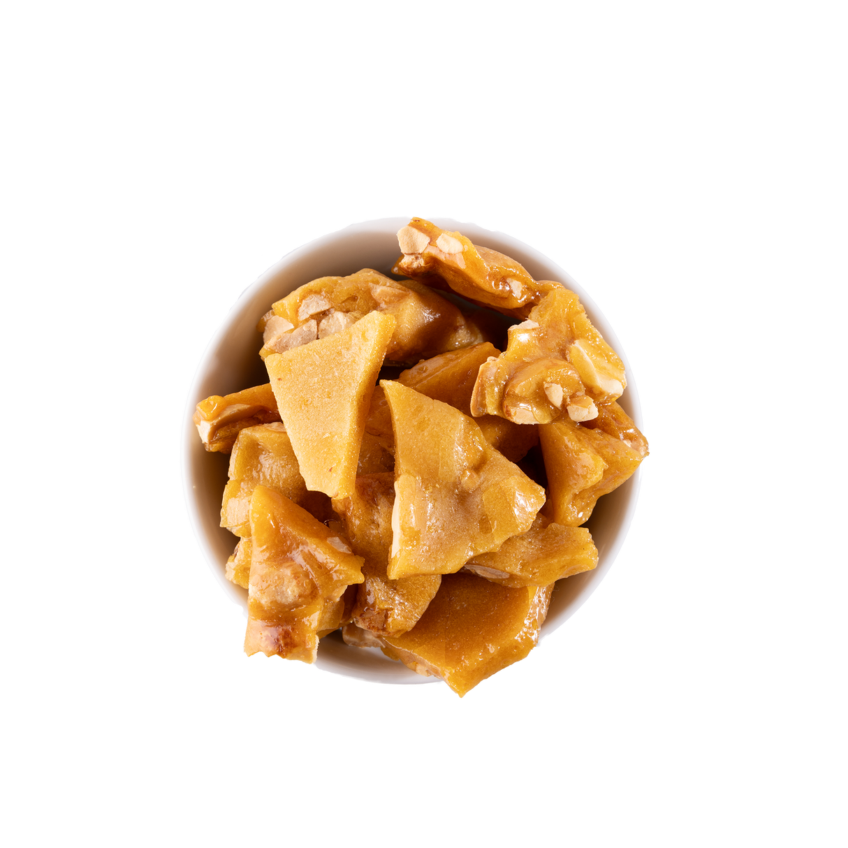 Peanut brittle in a white bowl