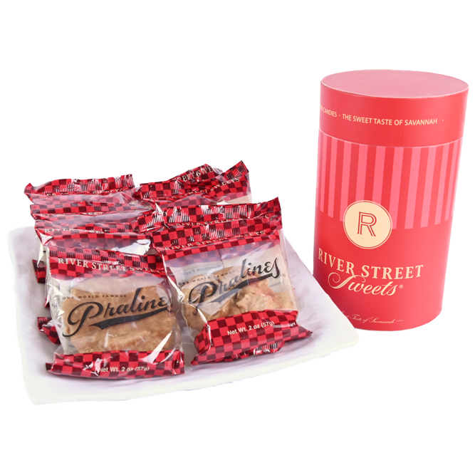 Packaged Pralines on a plate beside a red "River Street Sweets." canister
