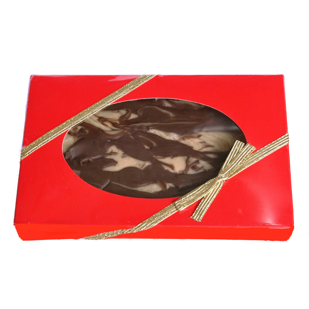 Peanut butter chocolate swirl fudge in a red box with a clear window and gold ribbon