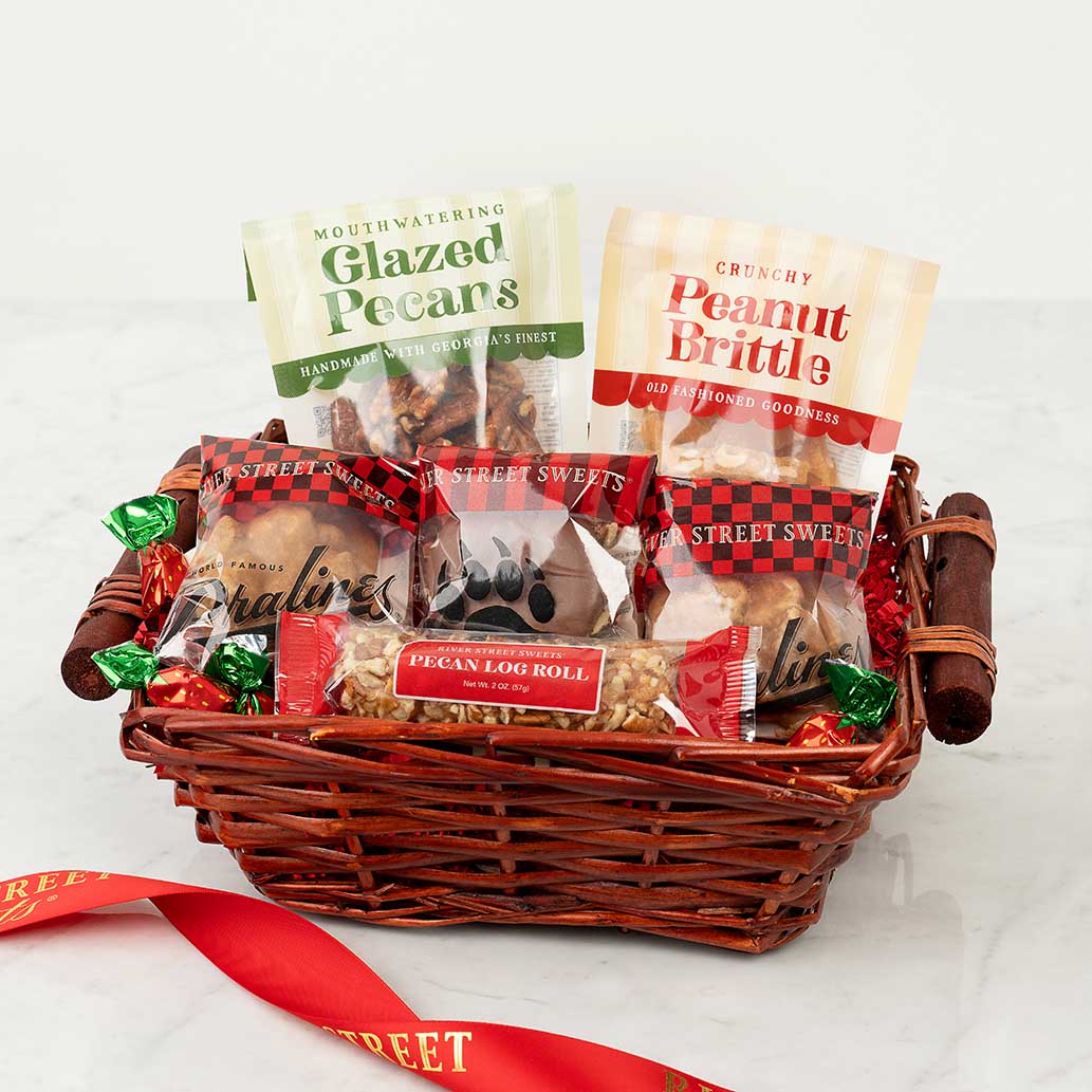 Basket of pet treats with visible packaging on a white background