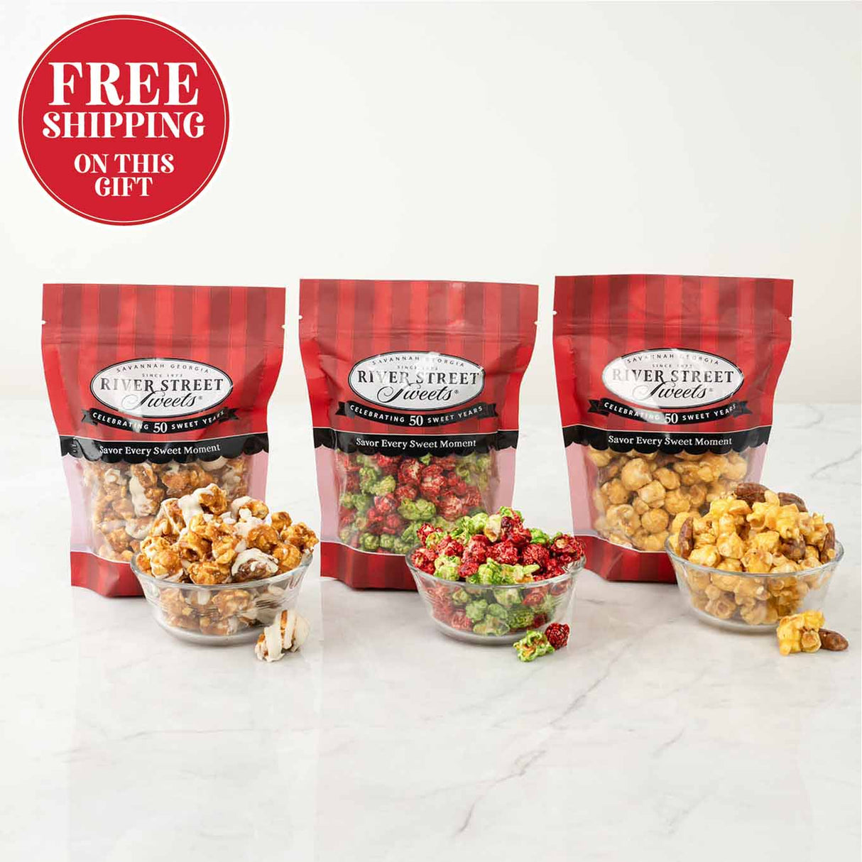 Three bags of River Street Treats with bowls of popcorn a on a white background, featuring free shipping text.