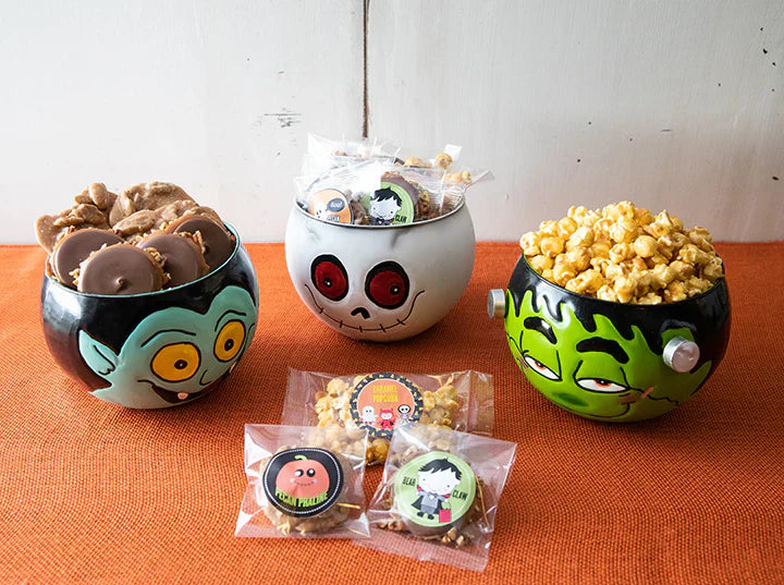 Halloween candy display with caramel apples and wrapped treats at River Street Sweets