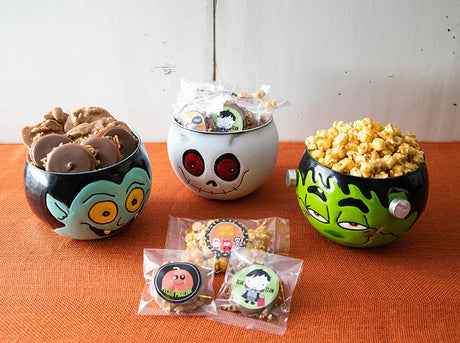 Halloween candy display with caramel apples and wrapped treats at River Street Sweets
