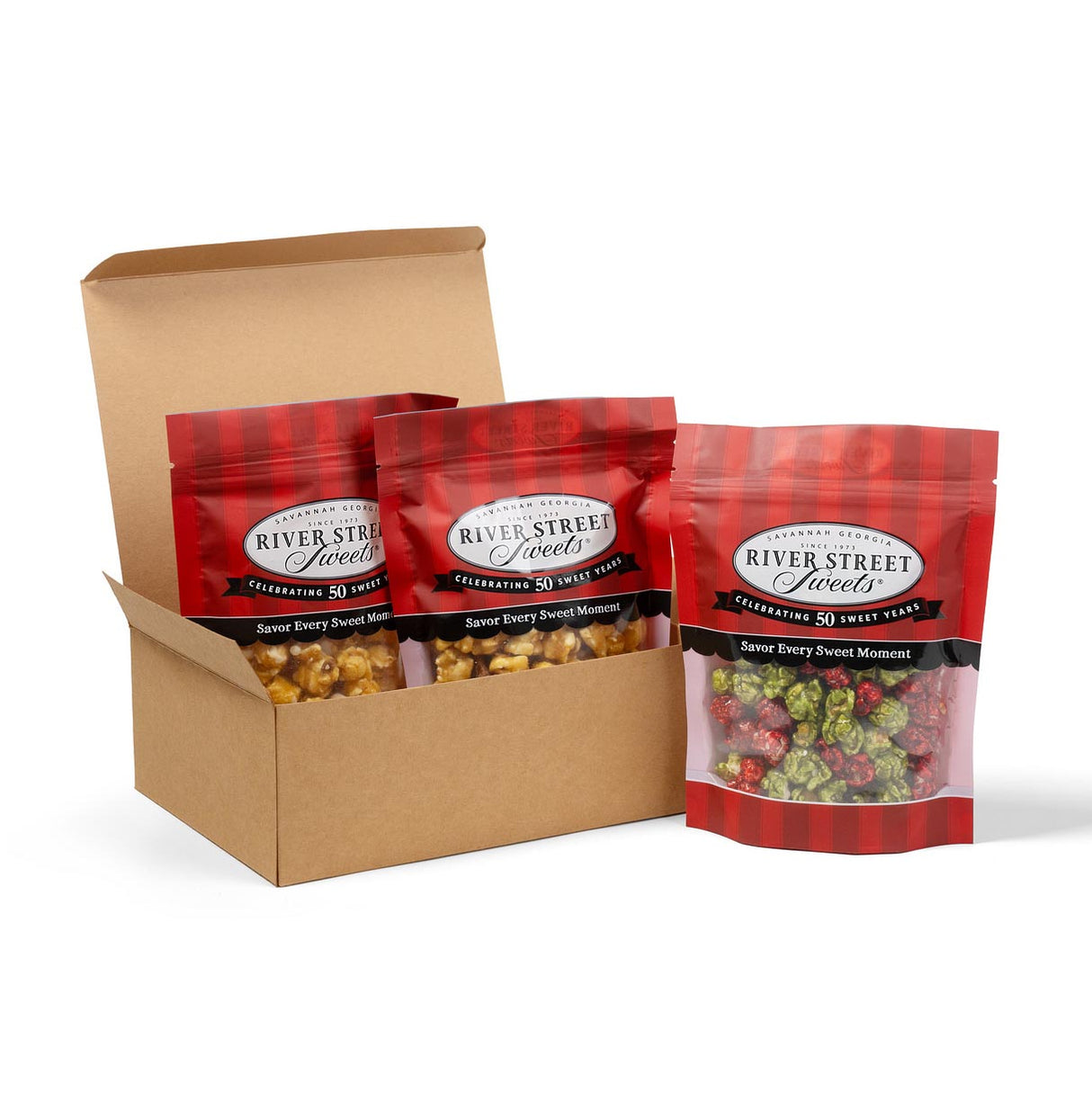 Box of River Street Sweets bags with red and black plaid design on a white background