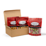 Box of River Street Sweets bags with red and black plaid design on a white background
