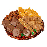 Assorted candy and snack platter including chocolates, nuts, and pralines on a white background
