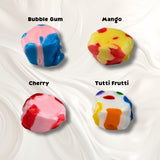 A white background with four pieces of taffy