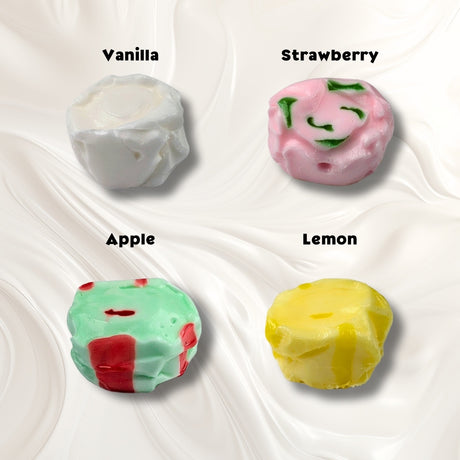A white background with four pieces of taffy