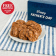 Plate of pralines with a Father's Day gift box on a striped cloth