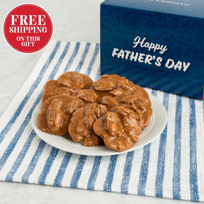 Plate of pralines with a Father's Day gift box on a striped cloth
