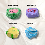 A white background with four pieces of taffy