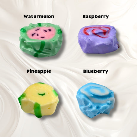 A white background with four pieces of taffy