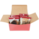 Packaged bear claws and pralines inside a red striped open box