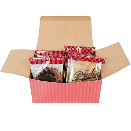 Packaged bear claws and pralines inside a red striped open box