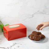 Hand grabbing bear claw with a red box in the background