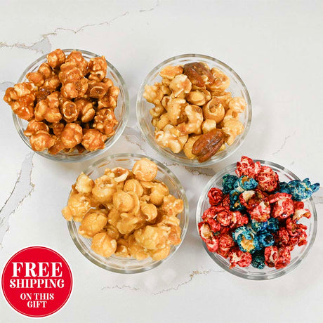 Four glass bowls of different flavored popcorn on a white marble surface with free shipping text.