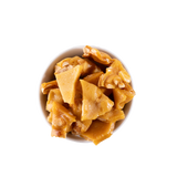 Peanut brittle in a white bowl