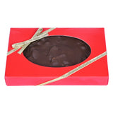 Chocolate pecan fudge in a red box with a clear window and gold ribbon