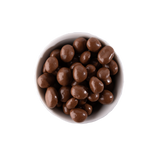 Chocolate covered peanuts in a white bowl