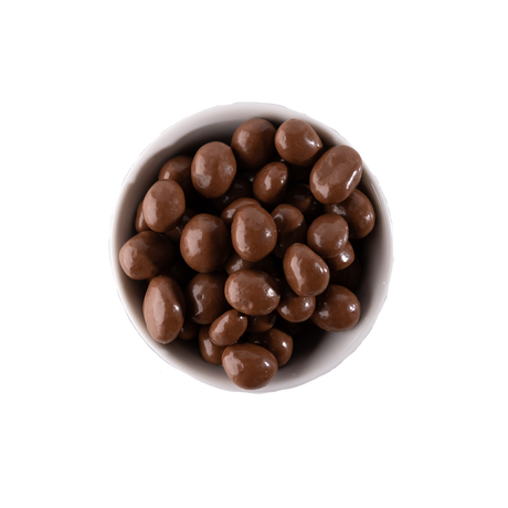 Chocolate covered peanuts in a white bowl