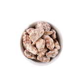 Cinnamon pecans in a white bowl