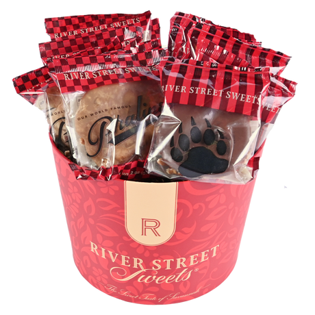 Wrapped pralines and bear claws in a red "River Street Sweets" tub