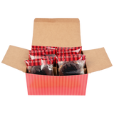 Open red-striped box containing packaged dark chocolate bear claws