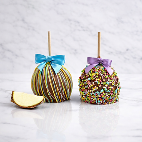 Two decorated apples with bows on a light gray background