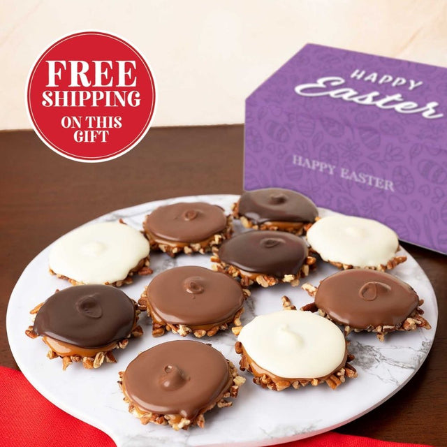 Plate of assorted bear claws with a purple 'Happy Easter' box on a brown surface.