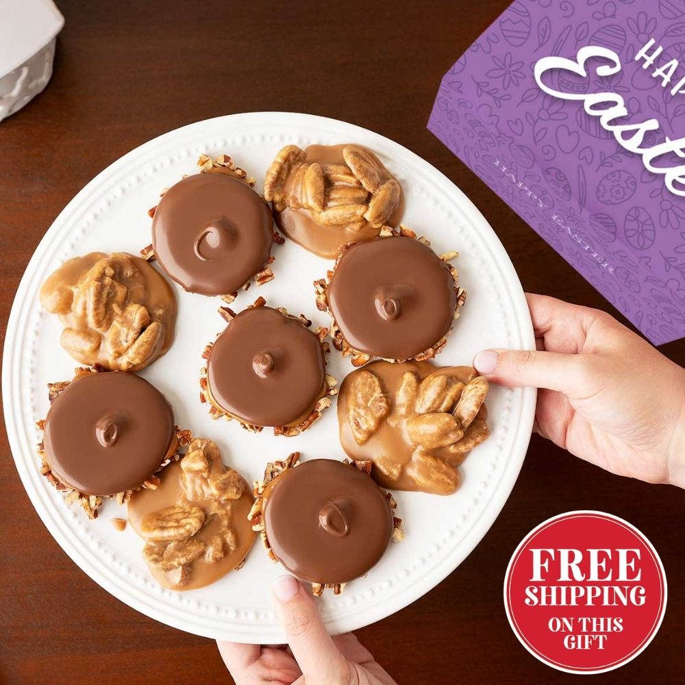 Plate of chocolate bear claws and pralines with a 'Happy Easter' box in the background