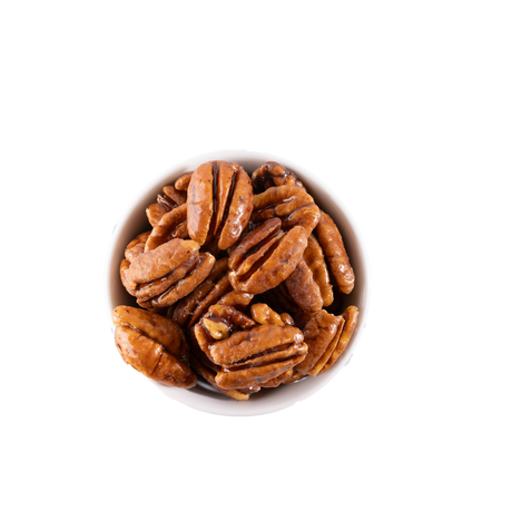 Glazed pecans in a white bowl