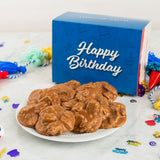 Plate of pralines with a blue 'Happy Birthday' box in the background