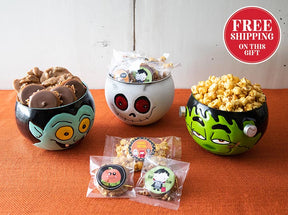Three decorative bowls with cartoonish faces filled with snacks on an orange surface, with a 'Free Shipping on This Gift' label in the corner.