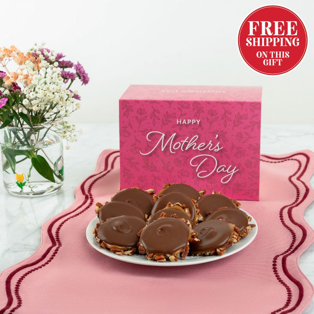 Plate of chocolate Bear Claws with a 'Happy Mother's Day' card and flowers on a pink surface.