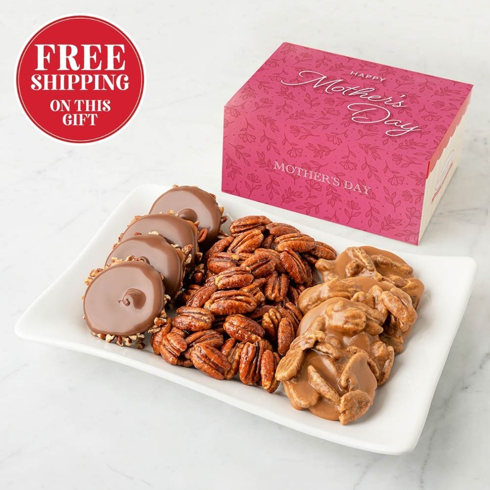 Bear claws, pralines, and glazed pecans on a plate with a pink 'Happy Mother's Day' box in the background.