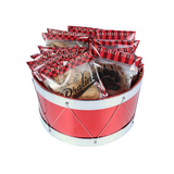 A red drum-shaped basket filled with wrapped pralines and bear claws