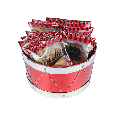 A red drum-shaped basket filled with wrapped pralines and bear claws