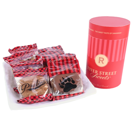 Packaged Pralines and Bear Claws beside a red "River Street Sweets" canister