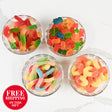Four glass bowls filled with colorful gummy candies on a white background, with a free shipping label.
