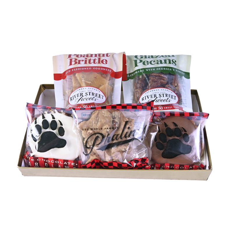 Assorted packaged candies in a red box