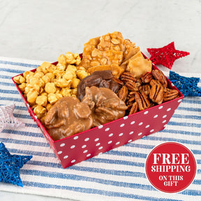 Red tray with white polka dots with candies on a white and blue  cloth