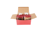 A red striped box with wrapped bear claws, pralines, and divinity peeling out the box