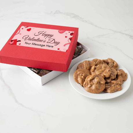Red Valentine's Day gift box with pralines on a white surface