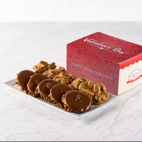 Bear Claws and Pralines on a plate with a Valentine's Day box in the background