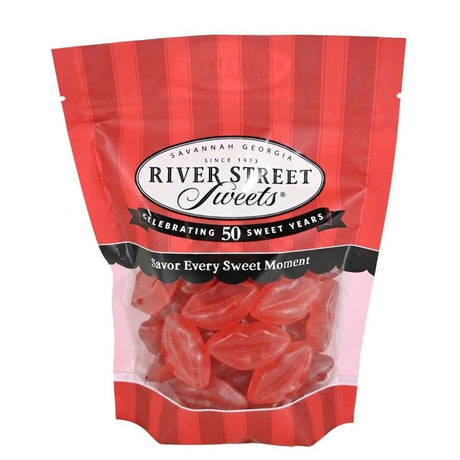 A bag of River Street Sweets red licorice candies on a plain white background. The packaging is red and white striped with a clear window showing the red licorice inside.