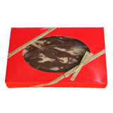 Peanut butter chocolate swirl fudge in a red box with a clear window and gold ribbon
