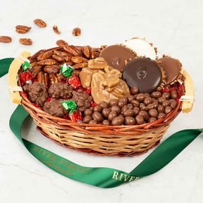Gourmet gift basket with chocolates, nuts, and candies on a white background